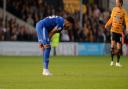 Macauley Bonne vents his frustration on the final whistle at Cambridge.