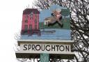 The village Sproughton village sign shows the wild man who was said to live in nearby Devil's Wood.