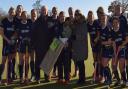 The Ipswich hockey squad with a pre-match presentation to long-serving manager Donna Mills befire their 3-0 win over Old Loughtonians. Picture: IHC