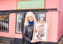 Sally Boazman with the art outside Eastern Frames in Haughley