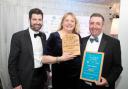 From left: Tom Burdett of LOCALiQ Eastern Counties, who presented the award, with Hannah and Ian Deane of Dairy Barns