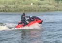 A group of men caused paddle boarders to fall into the water after driving jet skis too quickly
