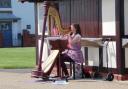 Zoe Anderton performing at Aldeburgh seafront.
