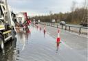 A lane is to remain closed on the A14 due to flooding since the end of February.