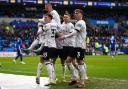Ipswich Town players celebrate Kieffer Moore's goal at Cardiff City.
