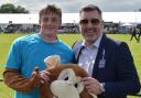 Mark Richardson aka Fast and Furious George the Suffolk New College mascot - with college principal Alan Pease