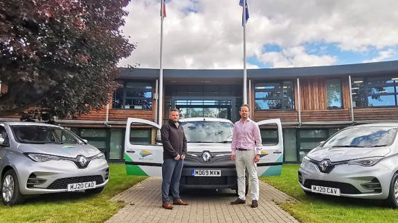 East Anglian Daily Times: Ashley Carver from East Suffolk Norse (left) with East Suffolk Council cabinet member for the environment James Mallinder and the new electric vehicles bought by the authority. PIcture: EAST SUFFOLK COUNCIL East Anglian Daily Times: Ashley Carver from East Suffolk Norse (left) with East Suffolk Council cabinet member for the environment James Mallinder and the new electric vehicles bought by the authority. PIcture: EAST SUFFOLK COUNCIL