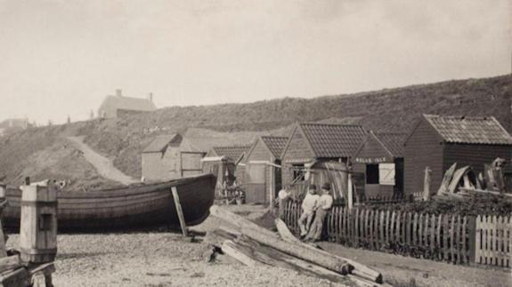 East Anglian Daily Times: Two Men by Fishing Sheds and Boat by P.H. Emerson East Anglian Daily Times: Two Men by Fishing Sheds and Boat by P.H. Emerson