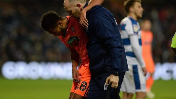 East Anglian Daily Times: Grant Ward is helped off the pitch in some discomfort at Loftus Road Picture Pagepix East Anglian Daily Times: Grant Ward is helped off the pitch in some discomfort at Loftus Road Picture Pagepix