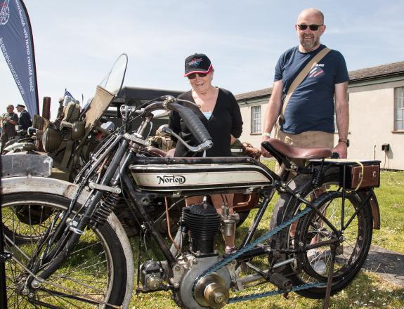 East Anglian Daily Times: Brynn and Gerei Hayes looking at a 1919 Norton motorcycle East Anglian Daily Times: Brynn and Gerei Hayes looking at a 1919 Norton motorcycle