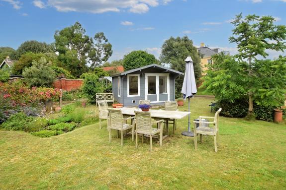 East Anglian Daily Times: The garden is mainly laid to lawn with a well-positioned summerhouse East Anglian Daily Times: The garden is mainly laid to lawn with a well-positioned summerhouse
