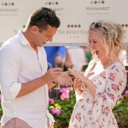 A couple who met on a bench in Newmarket's High Street two years ago are now engaged following a surprise proposal in the winner's enclosure of the Newmarket Racecourses.