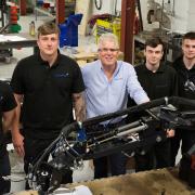 Richard Bridgman, chairman of Thetford-based Warren Services, with four of the company's apprentices