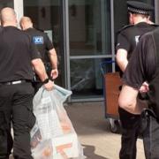Officers from the Kent and Essex Serious Crime Directorate with some of the seized items.