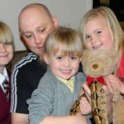 Stuart Brown, pictured with his three daughters, has died aged 45.