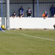 Lowestoft Town's Keiran Higgs and Stratford Town keeper Liam O'Brien.