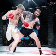 Jack Purdy, left, exchanging punches in his wild fight with Mikey Finn in the main event of Road to Contenders 3