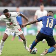 England's Raheem Sterling (left) and Italy's Emerson battle for the ball during the UEFA Euro 2020 Final at Wembley Stadium, London. Picture date: Sunday July 11, 2021.