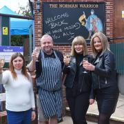 Cheers! Shaun Waters, landlord, with staff at The Norman Warrior in Lowestoft on April 12. Picture: Mick Howes