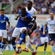 Freddie Ladapo is closely marked by a Bolton defender at Portman Road