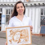 Aleksandra Shevchenko, a Ukrainian artist who has won a competition for her coffee art of the Queen