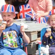 Conor and Niamh tuck into ice creams at the Proms in the Park for the jubilee celebrations.