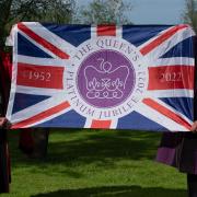 Mayor of Bungay, Tony Dawes, and Bungay Town Reeve, Olly Barnes, with the Jubilee flag.