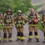 Mildenhall firefighters have climbed England's highest mountain to raise money for the East Anglian Air Ambulance Charity.