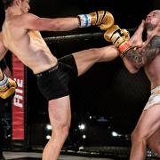 Dean Pattinson lands a teep to the chin of Charlie O'Neill in their main event at Contenders 30 Picture: BRETT KING