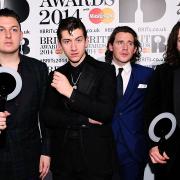 (L-R) Matt Helders, Alex Turner Jamie Cook and Nick O'Malley from Arctic Monkeys with their awards in the press room at the 2014 Brit Awards at the O2 Arena, London