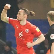 Will Keane punches the air after scoring to level the game 2-2.