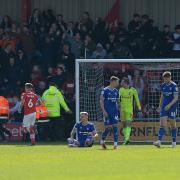 Town players after the home side equalises at Crewe Alexandra.