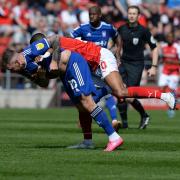 James Norwood wrestles an opponent early on at Rotherham
