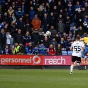 Shaun Whalley scores the equaliser against 10-man Ipswich Town at Shrewsbury yesterday
