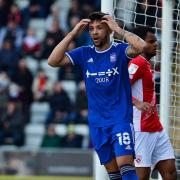 Macauley Bonne holds his head in disbelief after heading wide from point blank range at Morecambe.