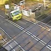 CCTV records a lorry being struck by a level crossing barrier in Essex
