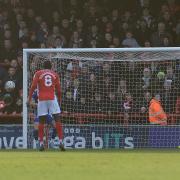 Aaron Wildig puts Morecambe ahead yesterday and spoils the run of clean sheets enjoyed by the Ipswich Town defence.