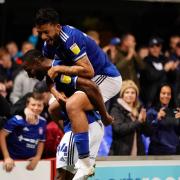 Janoi Donacien and Macauley Bonne celebrate after the victory over Doncaster Rovers