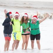 Despite the official St Elizabeth Hospice Christmas Day swim being cancelled many people braved the elements to take the plunge