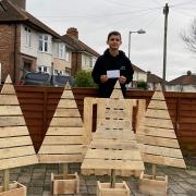 Ashton Fulcher has made a lot of Christmas trees out of wooden pallets for Ipswich residents this winter