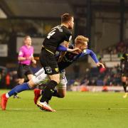 Joe Pigott goes down in the penalty area late against Oxford United. Town's penalty appeals were waved away
