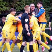 Even manager AFC Sudbury boss Rick Andrews joins the celebrations for Lewis O'Malley's match-clinching goal against Dartford