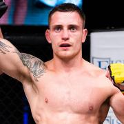 Leigh Mitchell has his hand raised after beating Aaron Laleye at Cage Warriors Academy South East 26 in Colchester
