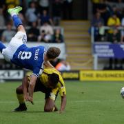 Lee Evans is cleaned out by a challenge from Michael Mancienne at The Pirelli Stadium.