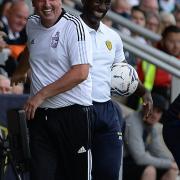The two managers are all smiles again after a little altercation on the touchline which resulted in Paul Cook being shown a yellow card at Burton Albion.