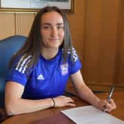 Ipswich Town Women's Sophie Peskett, pictured her signing her contract in June, achieved three BTEC distinctions