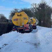 An oil tanker is blocking Mill Road in Badingham after becoming stuck in a ditch.
