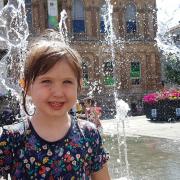 Aurora enjoying the fountains on the Cornhill last summer - but when will they be switched on this year? PICTURE: RACHEL EDGE
