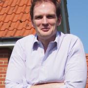 Dr Dan Poulter criticised the decision to approve new homes in Framlingham.
