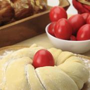 Easter sweet bread dough with red eggs